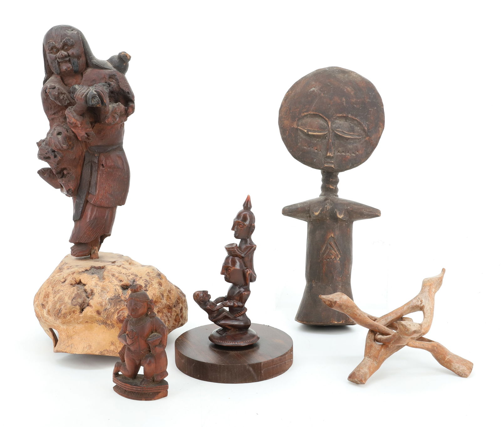 LOT OF ETHNOGRAPHIC CARVINGS: INCLUDING: ASIAN DEITY ON NEWER BASE (DEITY 9 1/4" H), AFRICAN CARVING 11 1/2" H. AND MORE. PLEASE READ CAREFULLY - Terms for Purchasing and Shipping of Auction Items. Please read carefully before bid