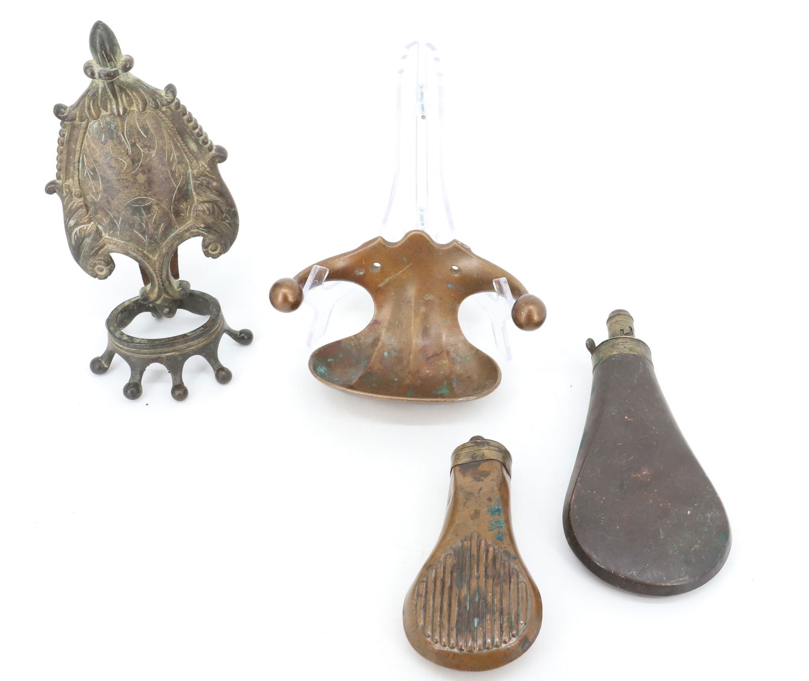 LOT OF COPPER POWDER FLASKS AND BRONZE: TWO POWDER FLASKS (LARGEST 7 3/4" L), PATINATED SOAP DISH AND BRONZE EMBLEM WITH CROWN AT TOP. PLEASE READ CAREFULLY - Terms for Purchasing and Shipping of Auction Items. Please read carefully before