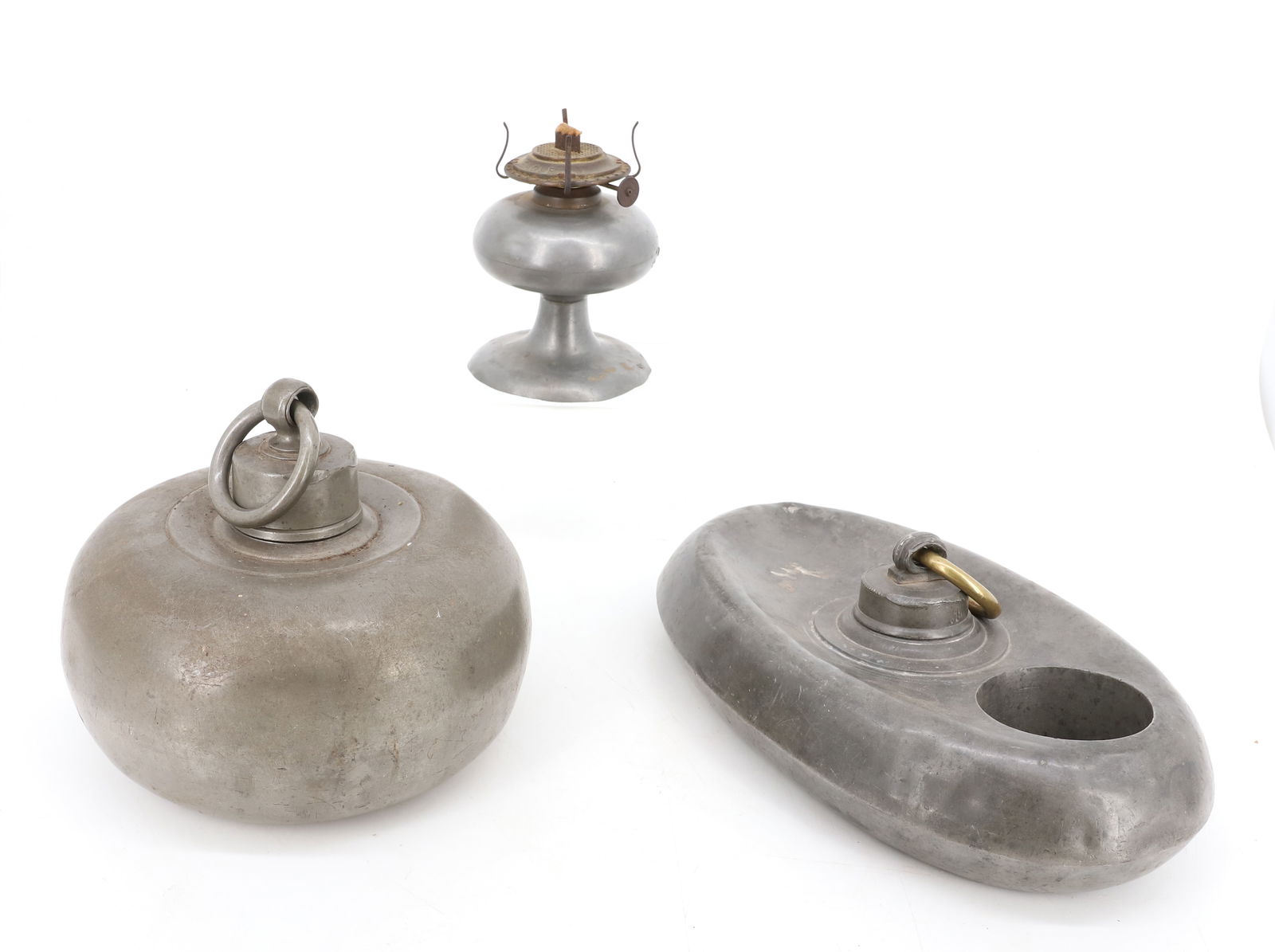 LOT OF PEWTER BED / FOOT WARMERS: OVAL 12" D. AND ROUND (MRKD. ON BOTTOM) WARMERS. WITH, KEROSENE LAMP. PLEASE READ CAREFULLY - Terms for Purchasing and Shipping of Auction Items. Please read carefully before bidding. Hartzell’s