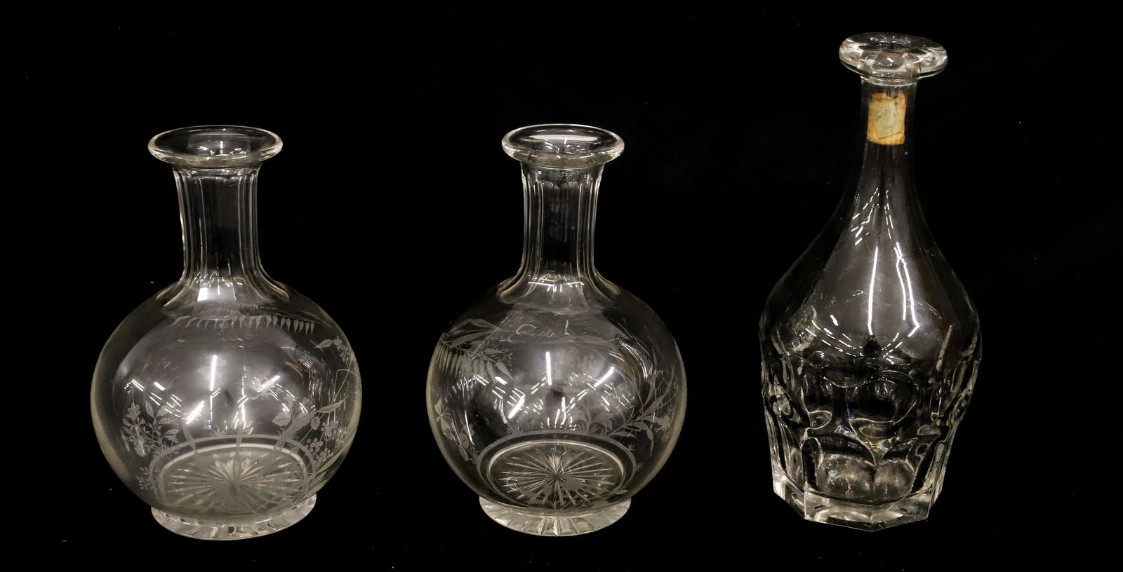 LOT OF (3) ANTIQUE DECANTERS: TWO HAVE MATCHING ETCHED SCENES (PLANTS / BUGS) 8" H. TALLEST IS HEAVY GLASS WITH PRONOUNCED LIP AND OCTAGONAL BASE. 10 1/4" H. PLEASE READ CAREFULLY - Terms for Purchasing and Shipping of Auction Ite