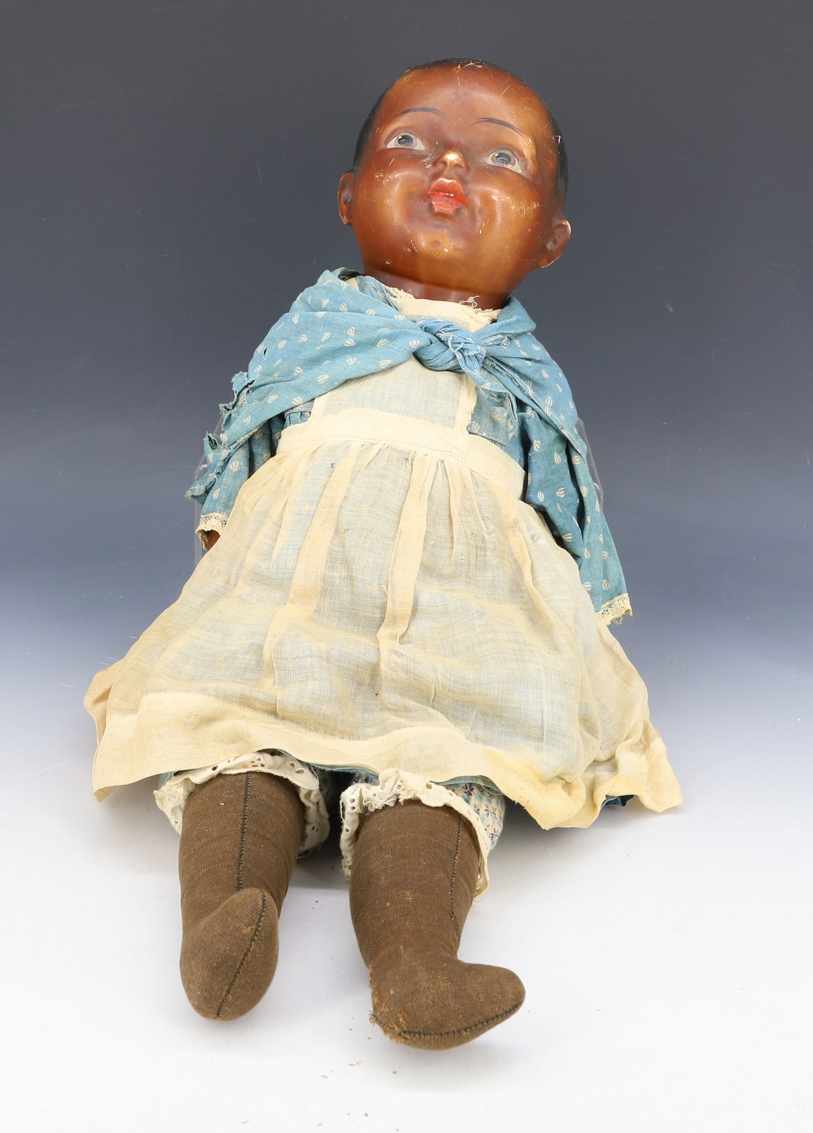 VINTAGE COMPOSITION BLACK AMERICANA DOLL: COMPOSITION HEAD AND ARMS/HANDS. CLOTHE BODY WITH COTTON CLOTHING. 20 1/2" L. APPEARS TO BE UNMARKED. PLEASE READ CAREFULLY - Terms for Purchasing and Shipping of Auction Items. Please read carefully