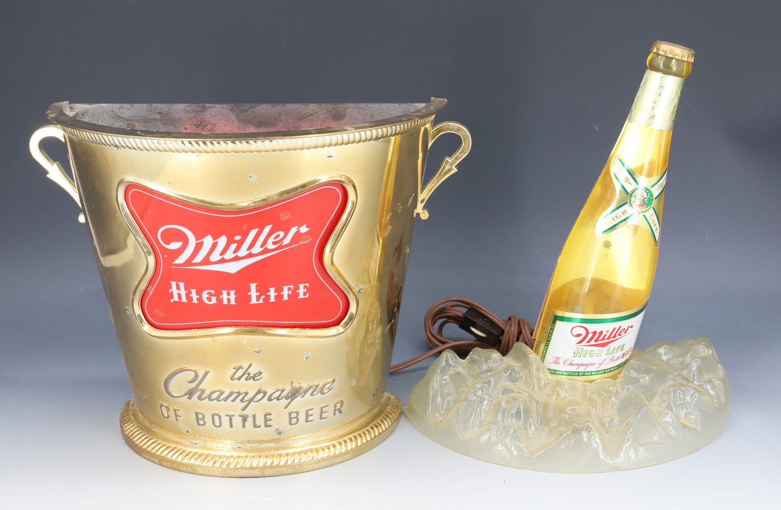 MILLER HIGH LIFE BEER SIGN: LIGHT-UP MOLDED PLASTIC BEER SIGN. MRKD. "THOMAS A. SCHUTZ CO. ILLINOIS" 18" H. PLEASE READ CAREFULLY - Terms for Purchasing and Shipping of Auction Items. Please read carefully before bidding. Hartze
