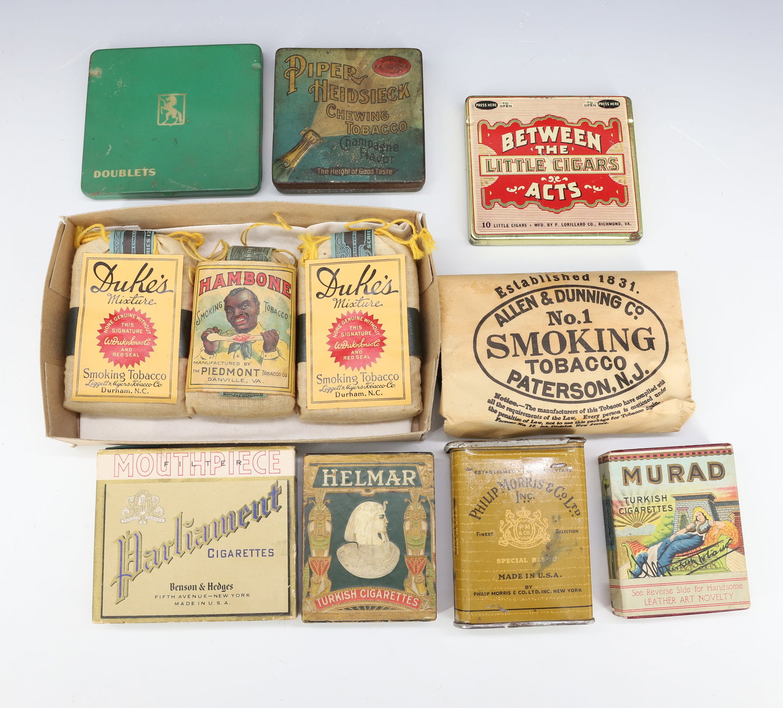 LOT OF CIGARETTE, TOBACCO AND CIGAR ITEMS: INCLUDING: PIPER HEIDSIECK, BETWEEN THE ACTS LITTLE CIGARS, CLOTH BAGS OF HAMBONE AND DUKES TOBACCO, MORE. PLUS, CARDBOARD BOXES OF CIGARETTES. PLEASE READ CAREFULLY - Terms for Purchasing and Shippin
