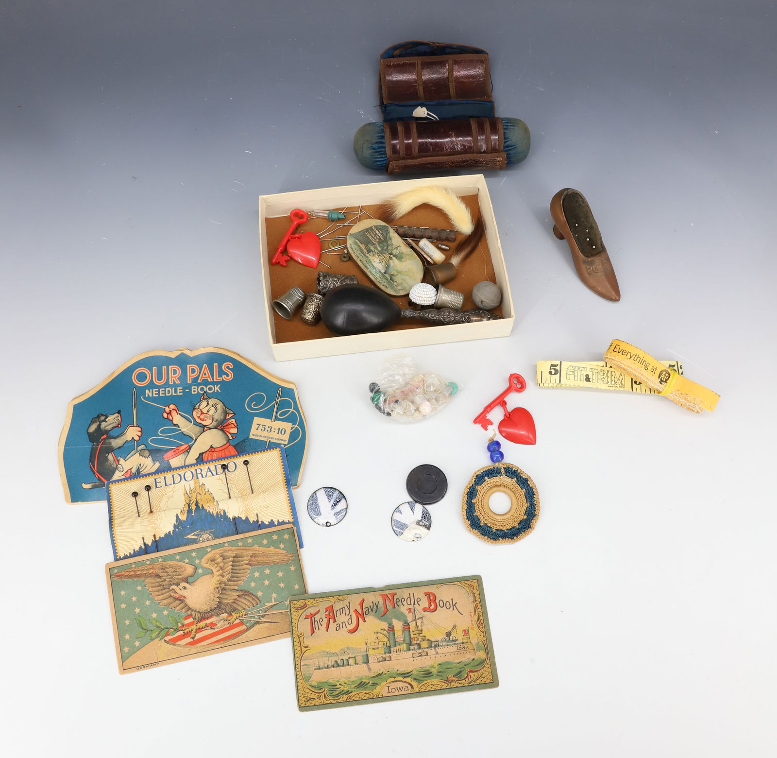 LOT OF SEWING RELATED ITEMS: INCLUDING: STERLING HANDLED DARNER, STERLING THIMBLE, NEEDLE BOOKS, PRUDENTIAL ADV. PIN HOLDER, SHOE PIN CUSHION 3 1/2" L. AND MORE. PLEASE READ CAREFULLY - Terms for Purchasing and Shipping of Auctio