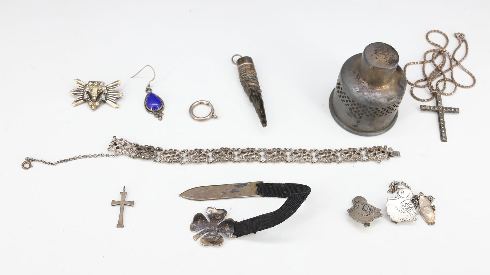 VINTAGE JEWELRY AND PEN/PENCIL: ART DECO STERLING PIN 1 3/8" L., STERLING SHAMROCK MRKD.LEONORE DUSKOW, BRACELET MRKD. STERLING, TWO BIRD CLIPS (STERLING), TWO CROSSES MRKD. STERLING AND SINGLE EARRING. PLUS, STERLING CANDLESTICK IN