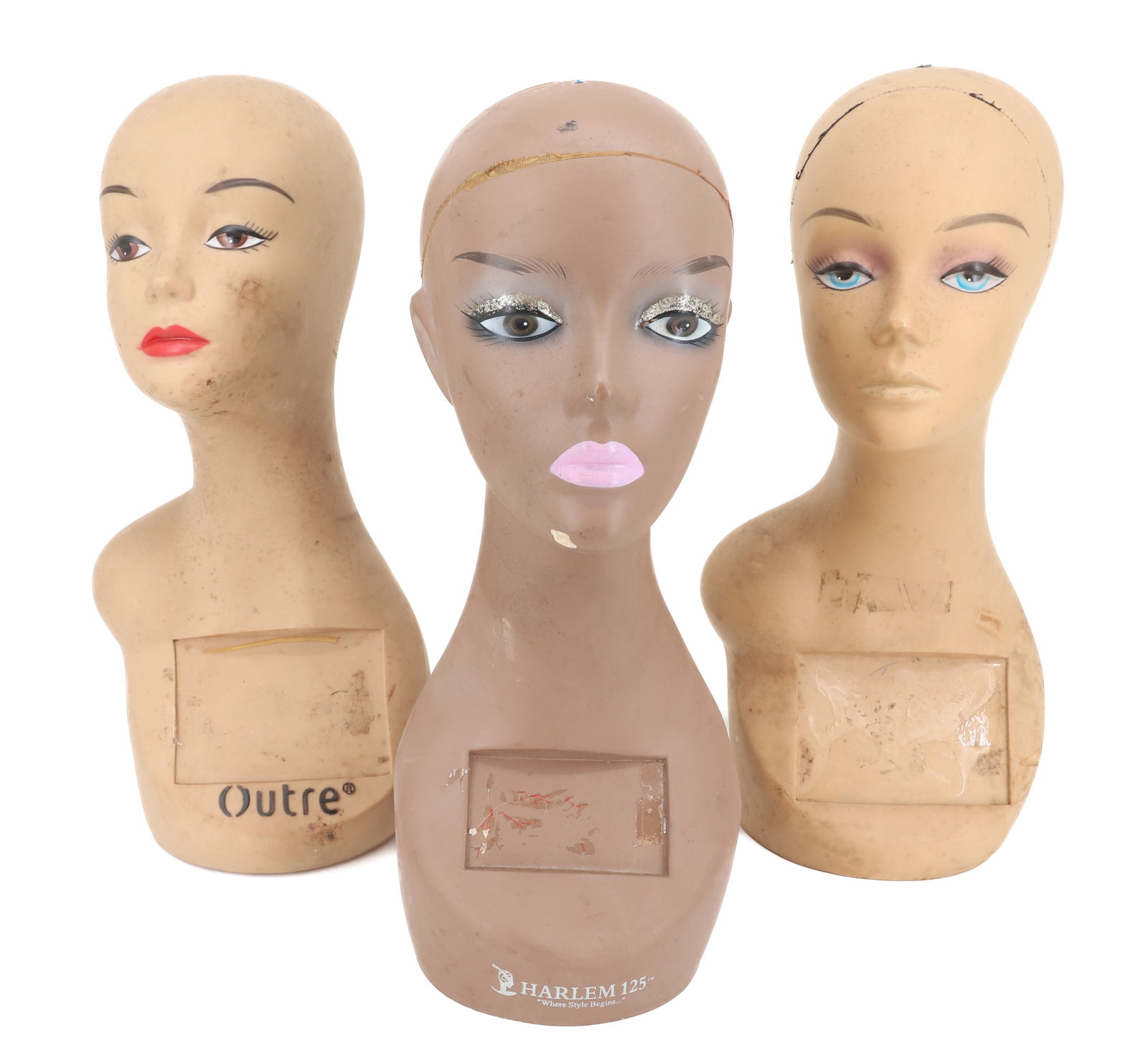 (3) VINYL MANNEQUIN HEADS / DISPLAYS: MADE IN CHINA. ONE MRKD. OUTRE AND ANOTHER MRKD. HARLEM 125. 18 1/4" H. PLEASE READ CAREFULLY - Terms for Purchasing and Shipping of Auction Items. Please read carefully before bidding. Hartzell’