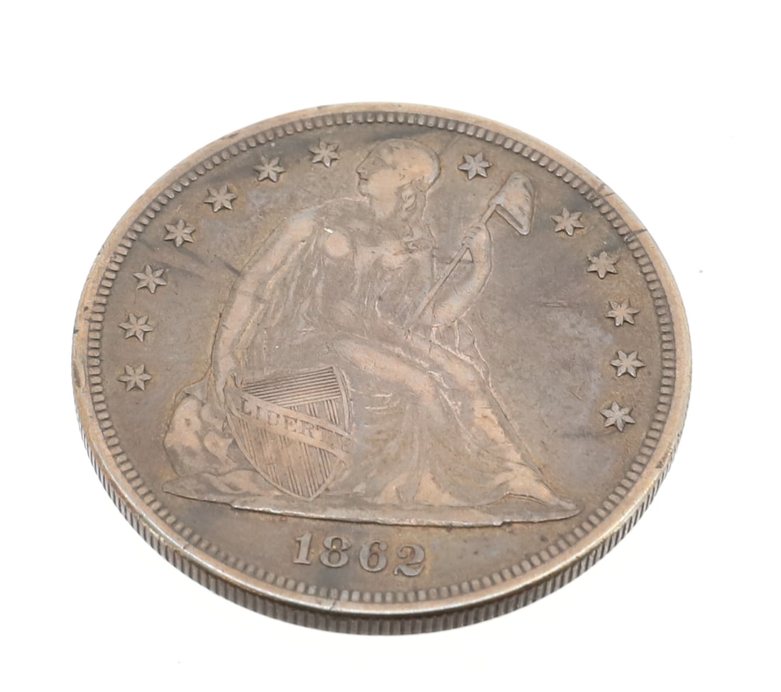 1862 SEATED LIBERTY DOLLAR: SEATED ONE DOLLAR SILVER COIN PLEASE READ CAREFULLY - SINCE THIS IS A COIN SALE PLEASE NOTE. ITEMS MUST BE PAID FOR THROUGH LIVE AUCTIONEERS OR WITH CASH OR CHECK IN PERSON - Terms for Purchasing and