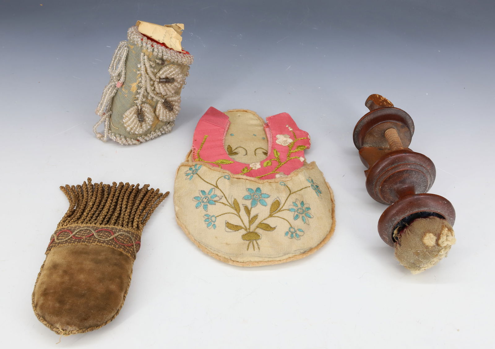 LOT OF PINCUSHIONS, SEWING RELATED: VELVET FRINGED PIN CUSHION 5 3/4" L., WOODEN SEWING CLAMP WITH CUSHION TOP 7" L., SMALL BEADED POUCH WITH OLD NOTE AND HORSESHOE SHAPED PIN HOLDER AND DECORATED HOLDER. PLEASE READ CAREFULLY - Terms f