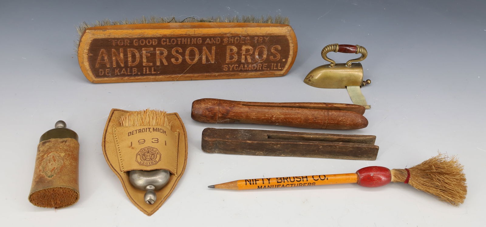 LOT OF BRUSHES, ADVERTISING AND MORE: MINIATURE BRUSHES W/ HOLDERS (ONE MRKD. DETROIT, MICH 1931 AMERICAN LEGION), BRASS IRON TAPE MEASURE, TWO WOODEN CLOTHESPINS, "ANDERSON BROS" ADV. BRUSH 7 5/8" L. AND "NIFTY BRUSH CO." PENCIL. PLEASE