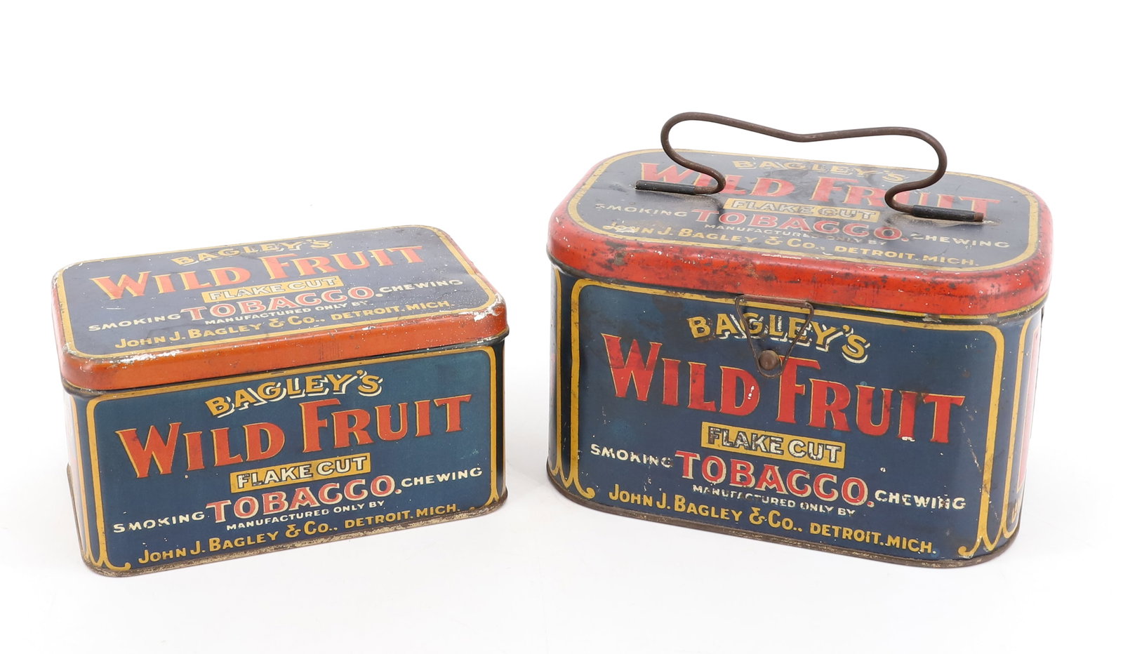 (2) BAGLEY'S WILD FRUIT TOBACCO TINS: TIN LITHO. "FLAKE CUT SMOKING // CHEWING TOBACCO, DETROIT, MICH". BOTH HAVE HINGED LIDS. LARGER HAS WIRE HANDLE ON TOP. 4 1/4" X 7" X 4 1/2". PLEASE READ CAREFULLY - Terms for Purchasing and Shipping 