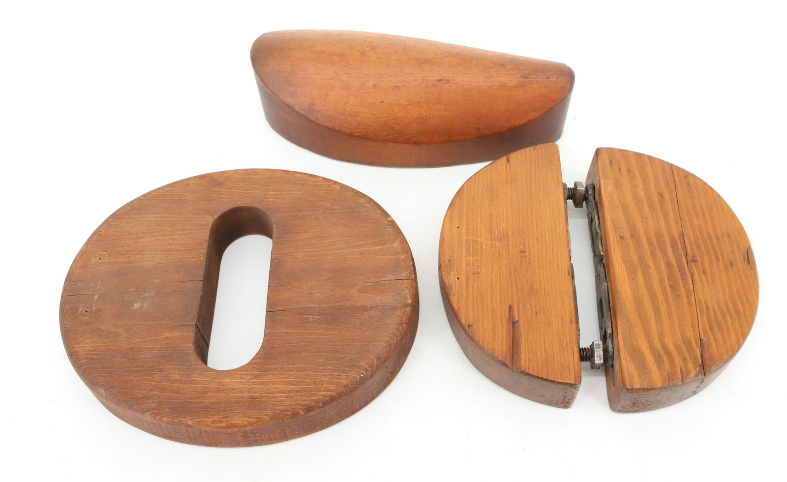 (3) WOODEN HAT BLOCKS: HAT BAND BLOCK MRKD. 7 1/8. TWO-PIECE CONNECTED BY BOLTS AND OBLONG MRKD. 7 1/8 AND "....SUPPLY HOUSE..." 8" L. PLEASE READ CAREFULLY - Terms for Purchasing and Shipping of Auction Items. Please read