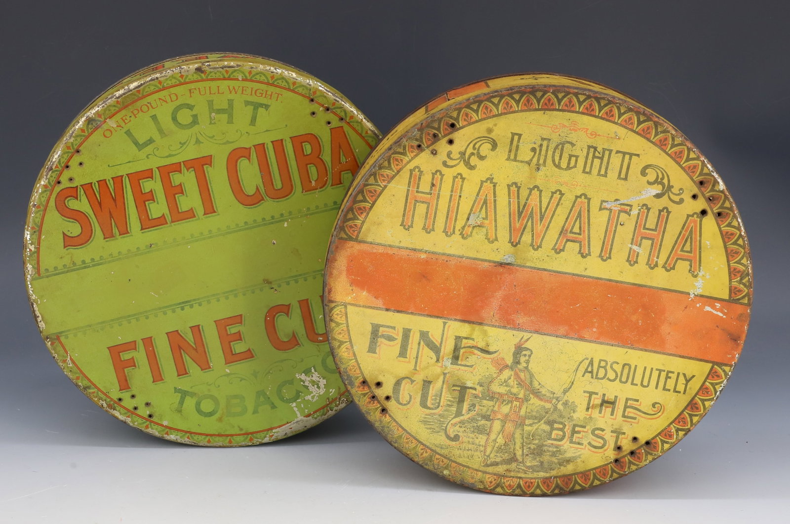 SWEET CUBA AND "HIAWATHA" TOBACCO TINS: TIN LITHO "SWEET CUBA FINE CUT TOBACCO" AND "LIGHT HIAWATHA FINE CUT" 8 1/4" D. PLEASE READ CAREFULLY - Terms for Purchasing and Shipping of Auction Items. Please read carefully before bidding. Hartze