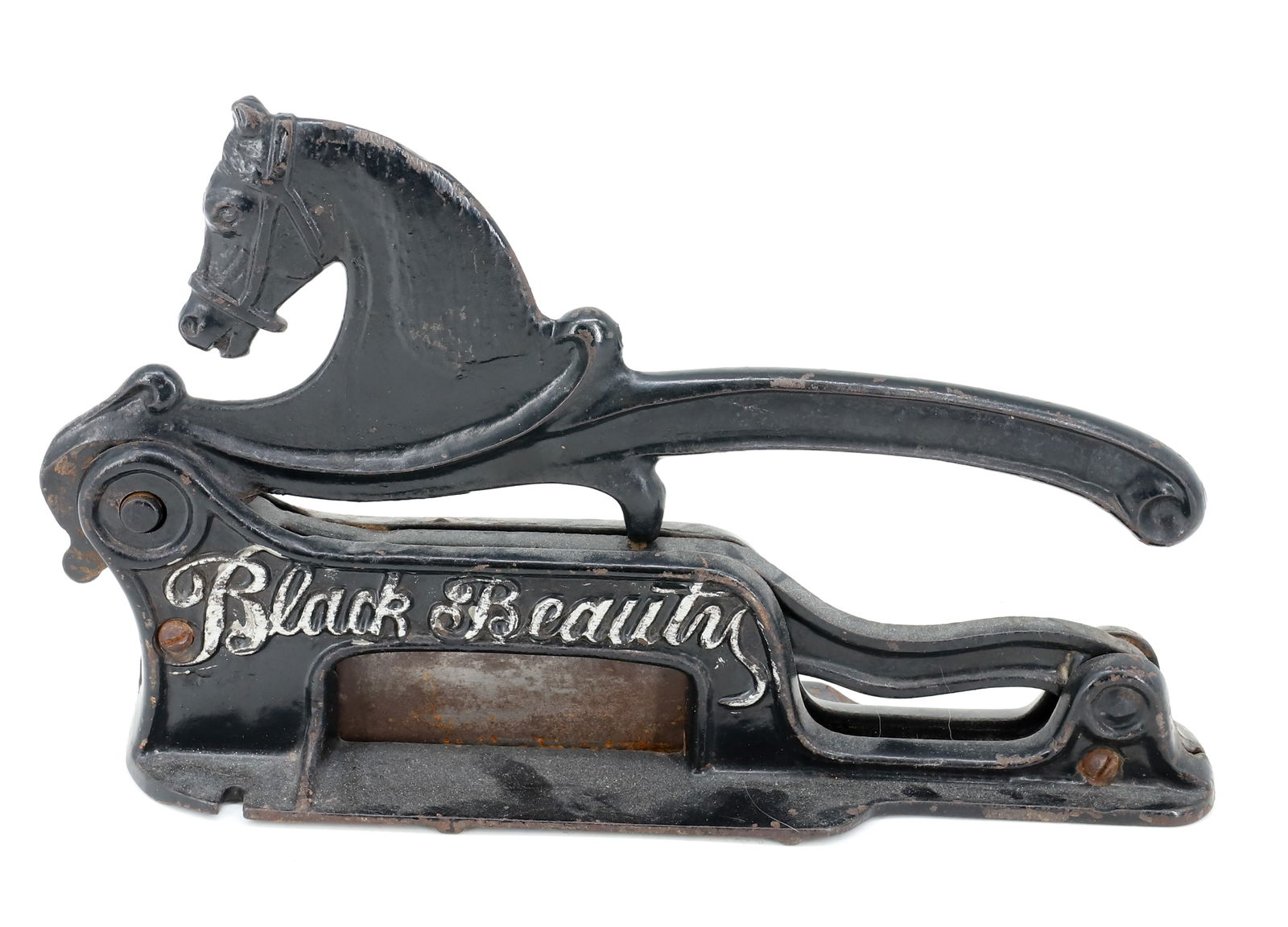 BLACK BEAUTY TOBACCO CUTTER: PAINTED CAST IRON MRKD. BLACK BEAUTY. 11 1/2" L. PLEASE READ CAREFULLY - Terms for Purchasing and Shipping of Auction Items. Please read carefully before bidding. Hartzell’s Auction Gallery. Har