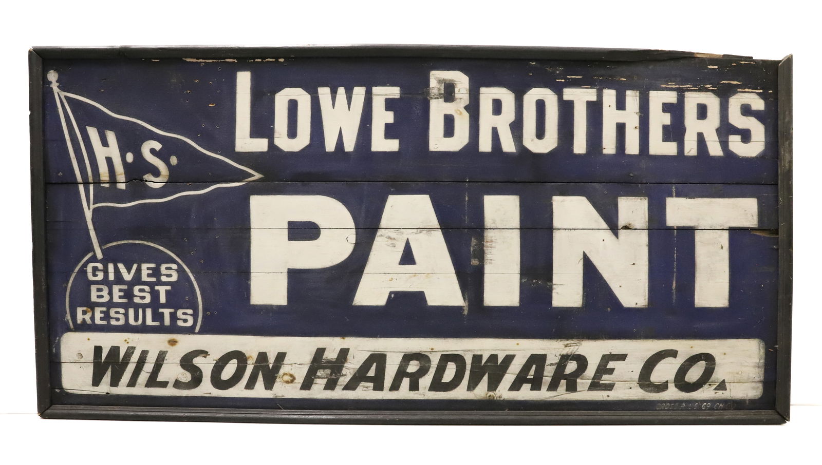 LOWE BROTHERS PAINT WOODEN ADVERTISING SIGN: BLUE / WHITE PAINTED SINGLE-SIDED SIGN "WILSON HARDWARE CO." SGND. BOTTOM RIGHT. BLACK WOODEN FRAMEWORK. 29 1/2" X 59 1/2". PLEASE READ CAREFULLY - Terms for Purchasing and Shipping of Auction Items.