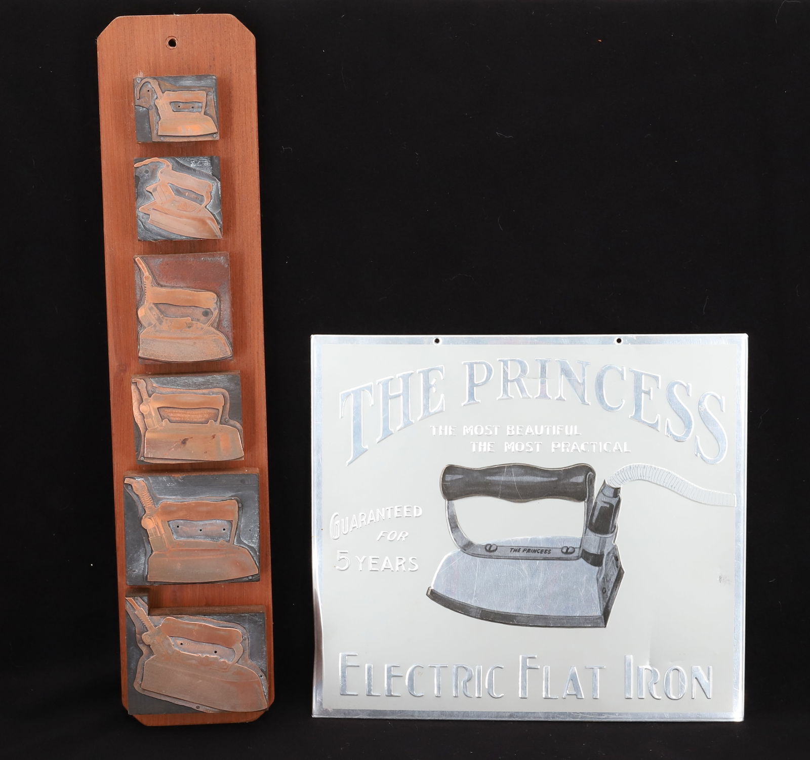 THE PRINCESS ELECTRIC FLAT IRON ADVERTISING SIGN: EMBOSSED/PRINTED WITH CARDBOARD BACKING. 8 7/8" X 9 7/8". WITH, (6) PRINTER'S BLOCKS OF IRONS. MOUNTED ON BOARD. 16" L. PLEASE READ CAREFULLY - Terms for Purchasing and Shipping of Auction Items. Plea
