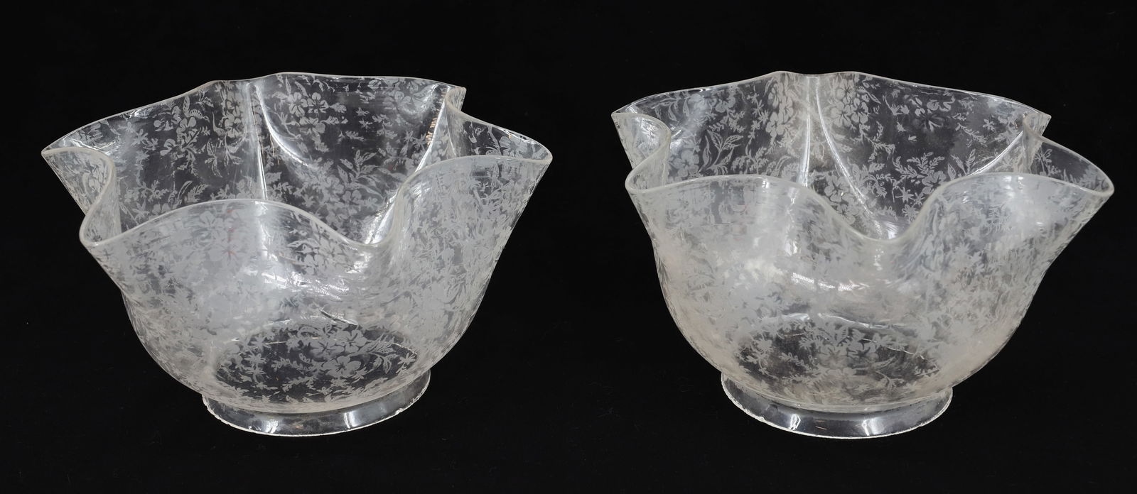 (2) ETCHED GLASS GAS SHADES: MATCHING PAIR OF RUFFLED EDGES WITH FLORAL PATTERN SHADES. 8 1/2" D. AT BOTTOM. FITTER IS 4" D. PLEASE READ CAREFULLY - Terms for Purchasing and Shipping of Auction Items. Please read carefully before