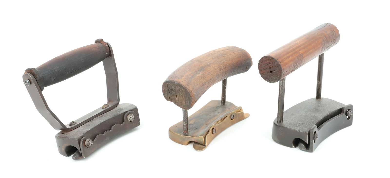 LOT OF HAT MAKING SHACKLES: TWO IRON SHACKLES AND ONE BRASS. WOODEN HAND GRIPS. PLEASE READ CAREFULLY - Terms for Purchasing and Shipping of Auction Items. Please read carefully before bidding. Hartzell’s Auction Gallery.