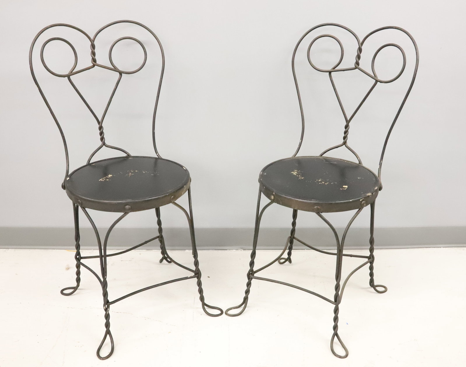 PAIR OF ICE CREAM PARLOR CHAIRS: BLACK PAINTED WIRE WITH BLACK PAINTED SEATS. PLEASE READ CAREFULLY - Terms for Purchasing and Shipping of Auction Items. Please read carefully before bidding. Hartzell’s Auction Gallery. Hartzel