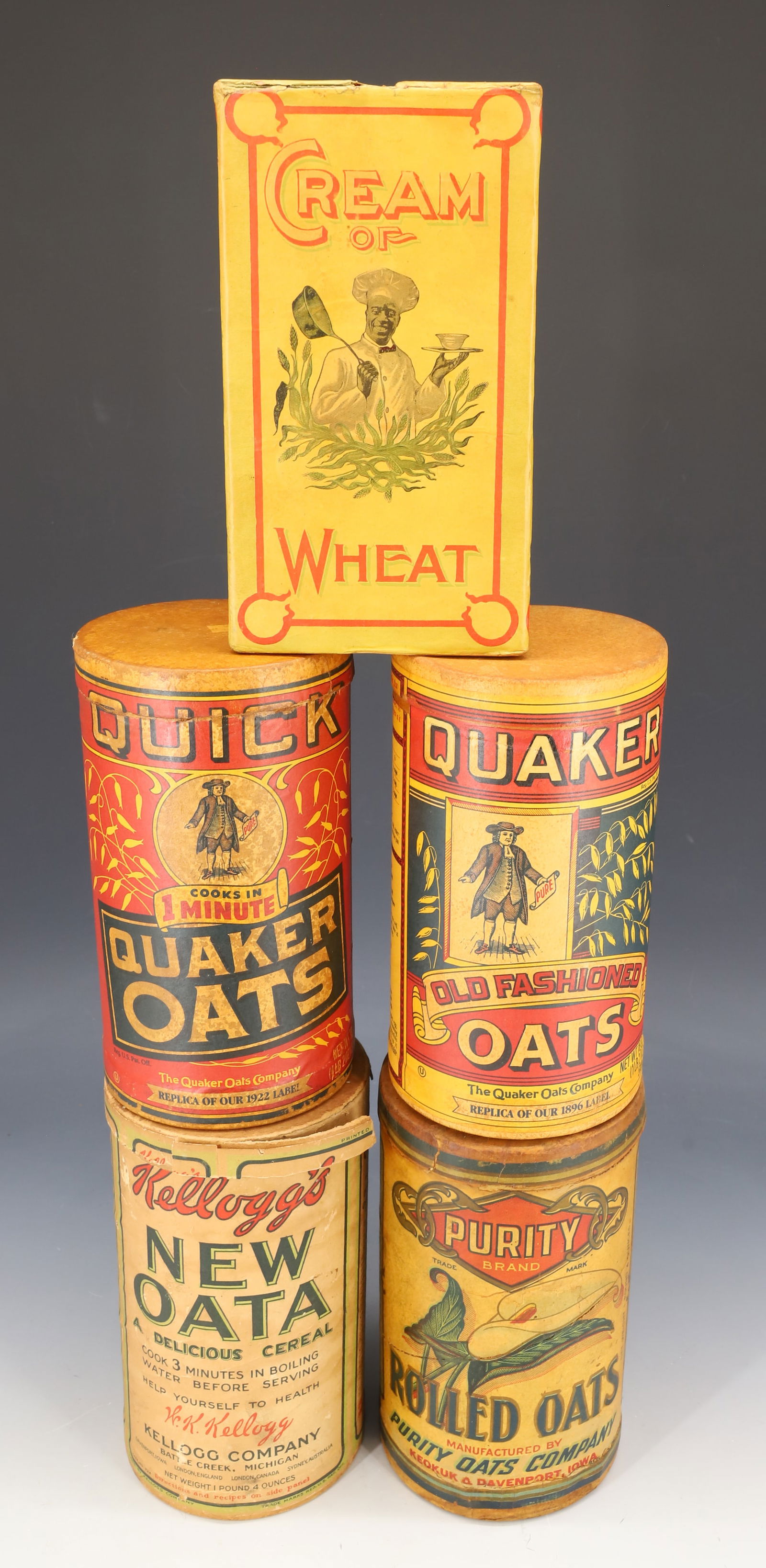 LOT OF PAPER LITHO / CARDBOARD ADVERTISING CONTAINERS: INCLUDING: (2) QUAKER OATS, PURITY ROLLED OATS (IOWA), KELLOGG'S NEW OATS AND BOX OF CREAM OF WHEAT 7 1/2" H. PLEASE READ CAREFULLY - Terms for Purchasing and Shipping of Auction Items. Please read ca