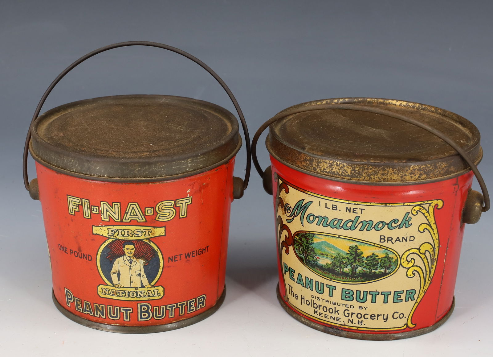 LOT OF (2) PEANUT BUTTER TINS: INCLUDING: MONADNOCK BRAND (KEENE, NH) 3 1/2" H. WITH, FI-NA-ST FIRST NATIONAL (SOMERVILLE, MASS) 3 3/4" H. PLEASE READ CAREFULLY - Terms for Purchasing and Shipping of Auction Items. Please read care