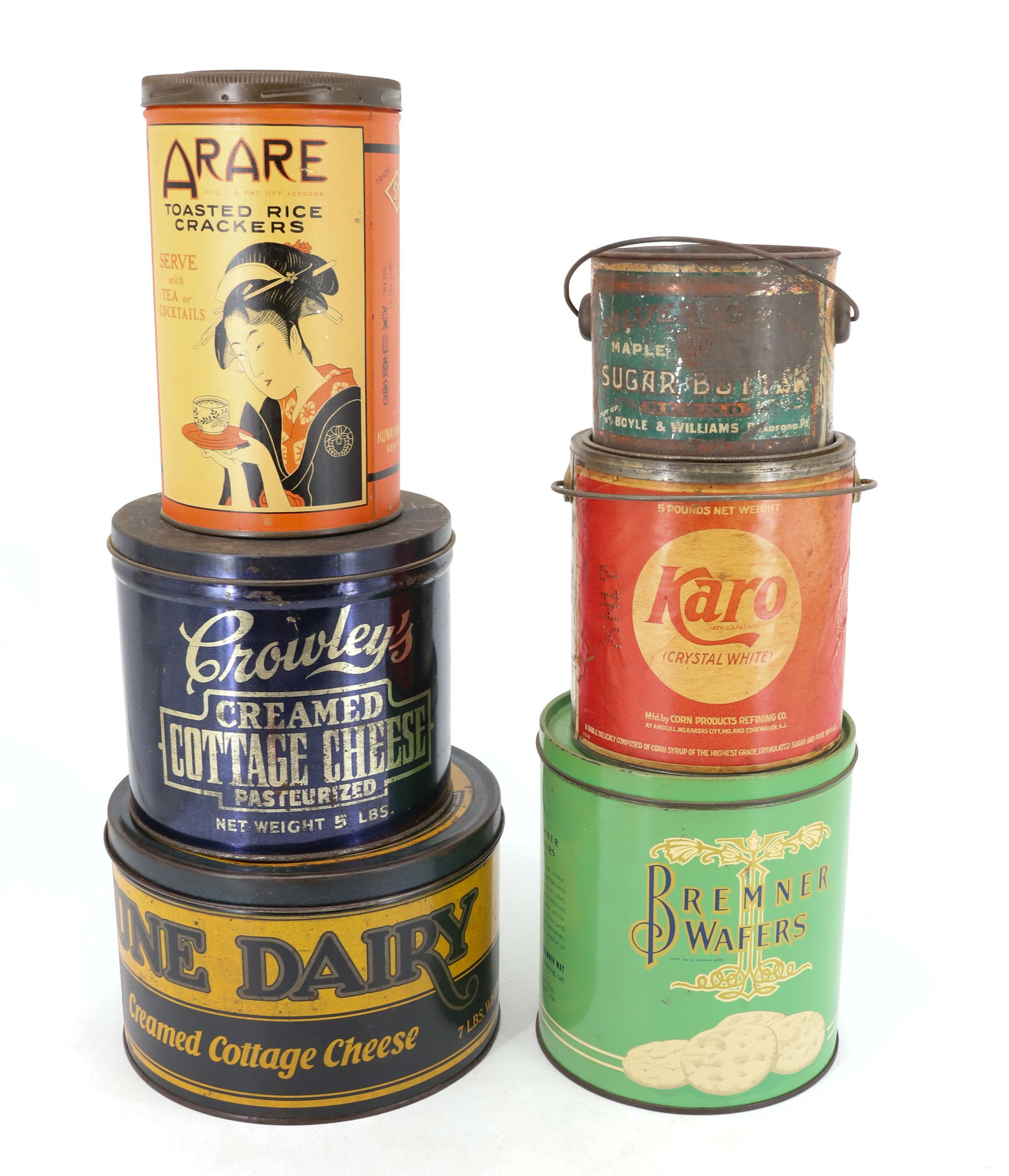 LOT OF VINTAGE ADVERTISING TINS: TIN LITHO INCLUDING: ARARE CRACKERS (7 1/2" H), BREMNER WAFERS, JUNE DAIRY COTTAGE CHEESE (7 1/2" D.), CROWLEY'S COTTAGE CHEESE, SUGAR BUTTER (BRADFORD,PA), KARO (PAPER LITHO LABEL). PLEASE READ CAREF