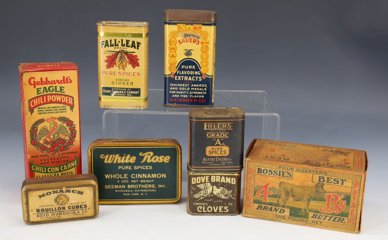 LOT OF VINTAGE SPICE TINS: INCLUDING: FALL-LEAF GINGER (PATERSON,NJ), DOVE BRAND CLOVES (CINCINNATI), GEBHARDT'S EAGLE CHILI POWDER (CARDBOARD) 6" H., BOSSIE'S BEST BRAND BUTTER 4 3/4" L, SAUER'S CINNAMON (RICHMOND, VA) 4 1/4"
