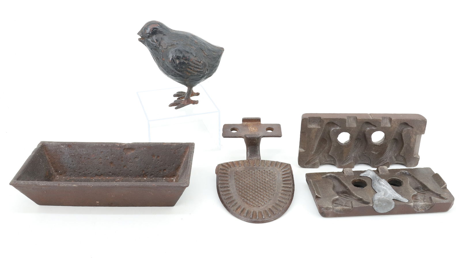 LOT OF CAST IRON SMALLS: INCLUDING: TWO-PIECE BIRD MOLD 5 3/4" L. (MRKD. 24), BLACK PAINTED HOLLOW BODY CHICK 4" H., SMALL TROUGH AND BUGGY STEP. PLEASE READ CAREFULLY - Terms for Purchasing and Shipping of Auction Items. Ple