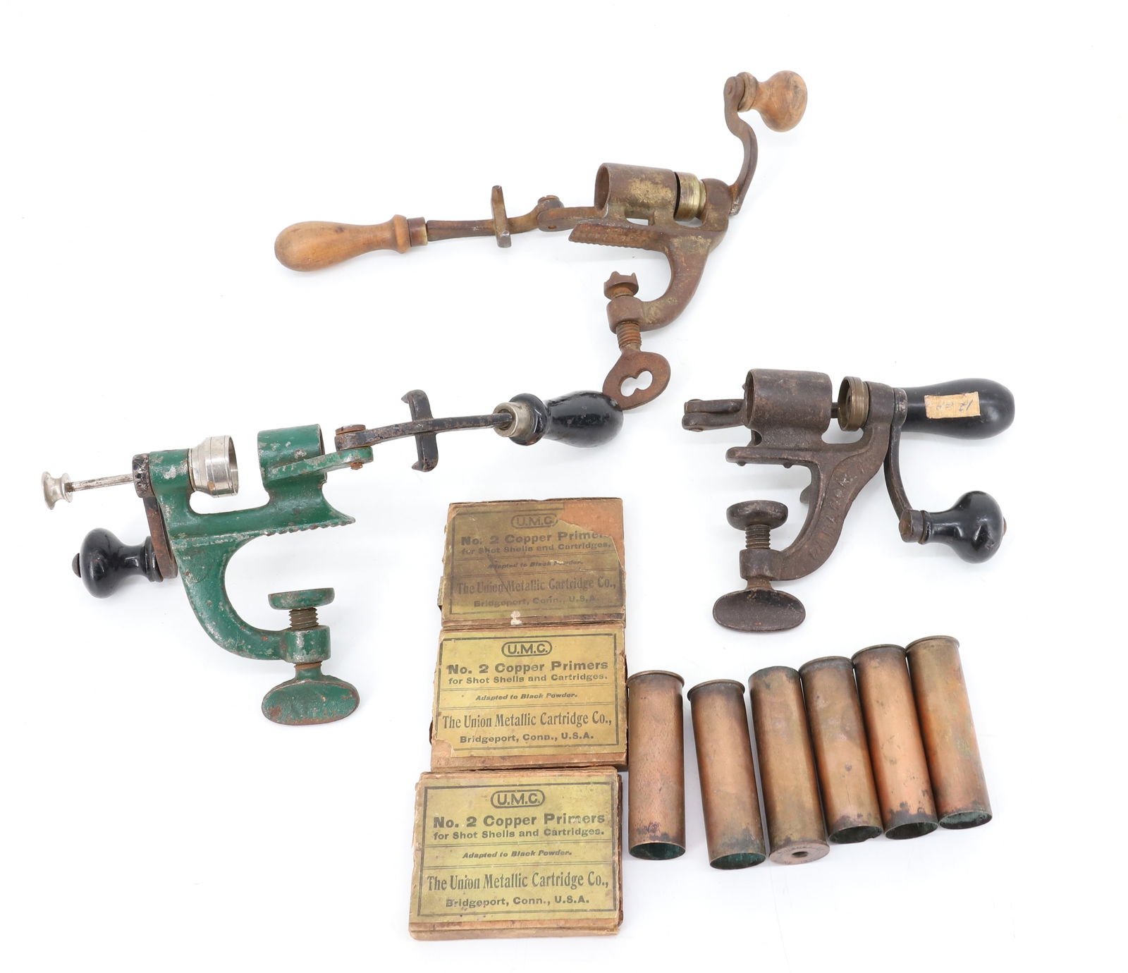 LOT OF SHOTGUN SHELL RELOADERS AND MORE: (3) RELOADERS. 12 AND 16 GAUGE. CAST IRON WITH WOODEN GRIPS. ONE MRKD. PARAGON 12. SEVERAL CASINGS WITH, PACKS OF COPPER PRIMERS. PLEASE READ CAREFULLY - Terms for Purchasing and Shipping of Auction I