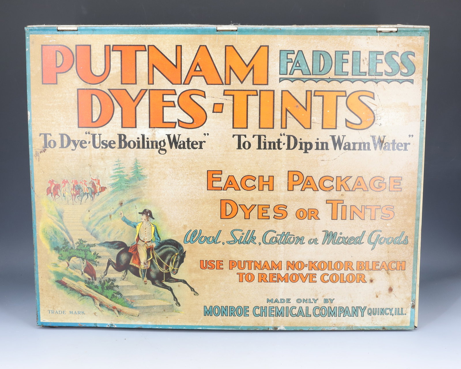 PUTNAM DYES ADVERTISING DISPLAY CASE: TIN LITHO WITH LIFT-UP FRONT AND DIVIDED INTERIOR. 14 3/4" X 18 3/4" X 7 1/2". PLEASE READ CAREFULLY - Terms for Purchasing and Shipping of Auction Items. Please read carefully before bidding. Hartzel