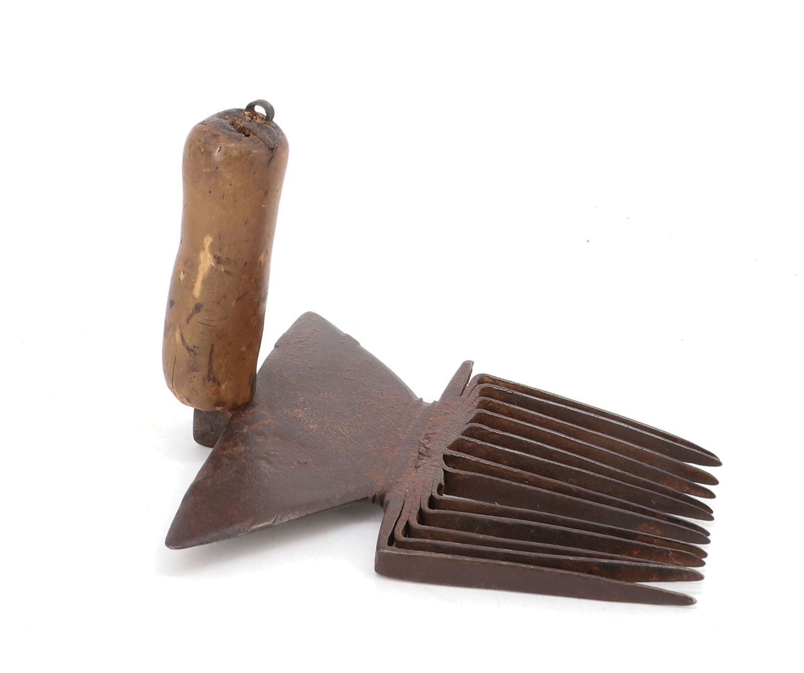 PRIMITIVE IRON HATCHEL: SHAPED IRON WITH WOODEN HAND GRIP. 7" X 4 1/2". PLEASE READ CAREFULLY - Terms for Purchasing and Shipping of Auction Items. Please read carefully before bidding. Hartzell’s Auction Gallery. Hart