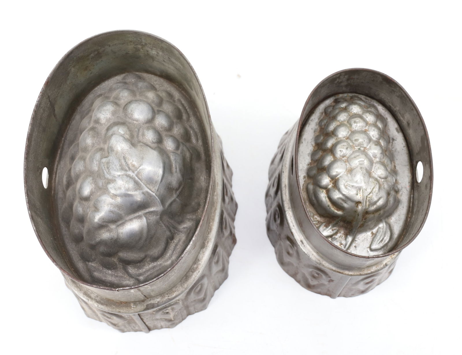 (2) TIN / COPPER "GRAPE" FOOD MOLDS: 5 1/8" TO 6 1/2" LENGTHS. PLEASE READ CAREFULLY - Terms for Purchasing and Shipping of Auction Items. Please read carefully before bidding. Hartzell’s Auction Gallery. Hartzell's Auction Gallery