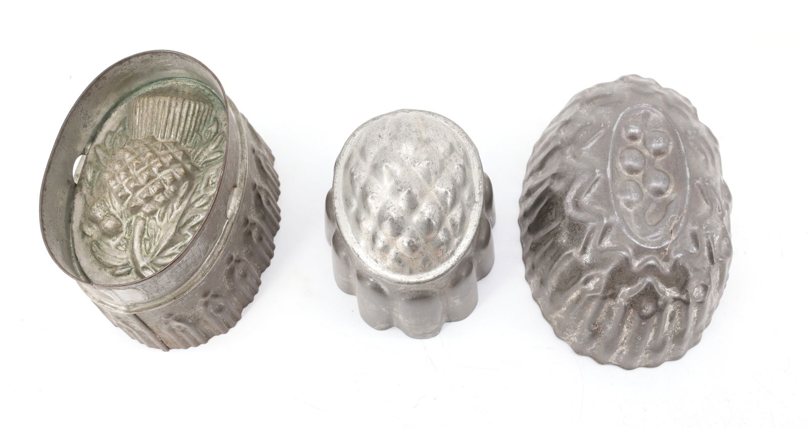 (3) TIN / COPPER FOOD MOLDS: THISTLE AND FRUIT DESIGNS. 4" TO 6" LENGTHS. PLEASE READ CAREFULLY - Terms for Purchasing and Shipping of Auction Items. Please read carefully before bidding. Hartzell’s Auction Gallery. Hartzel