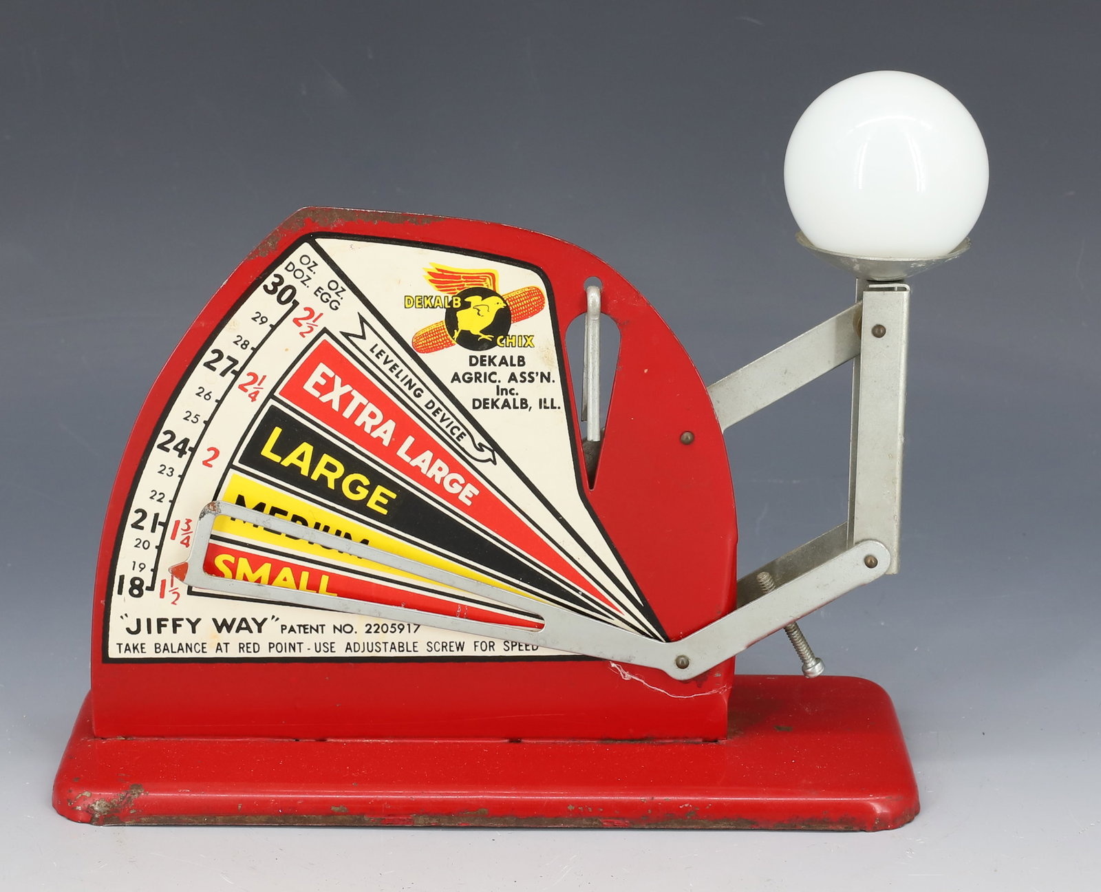 DEKALB "JIFFY WAY" EGG SCALE: PAINTED METAL / ALUMINUM. 8" L. PLEASE READ CAREFULLY - Terms for Purchasing and Shipping of Auction Items. Please read carefully before bidding. Hartzell’s Auction Gallery. Hartzell's Auction G