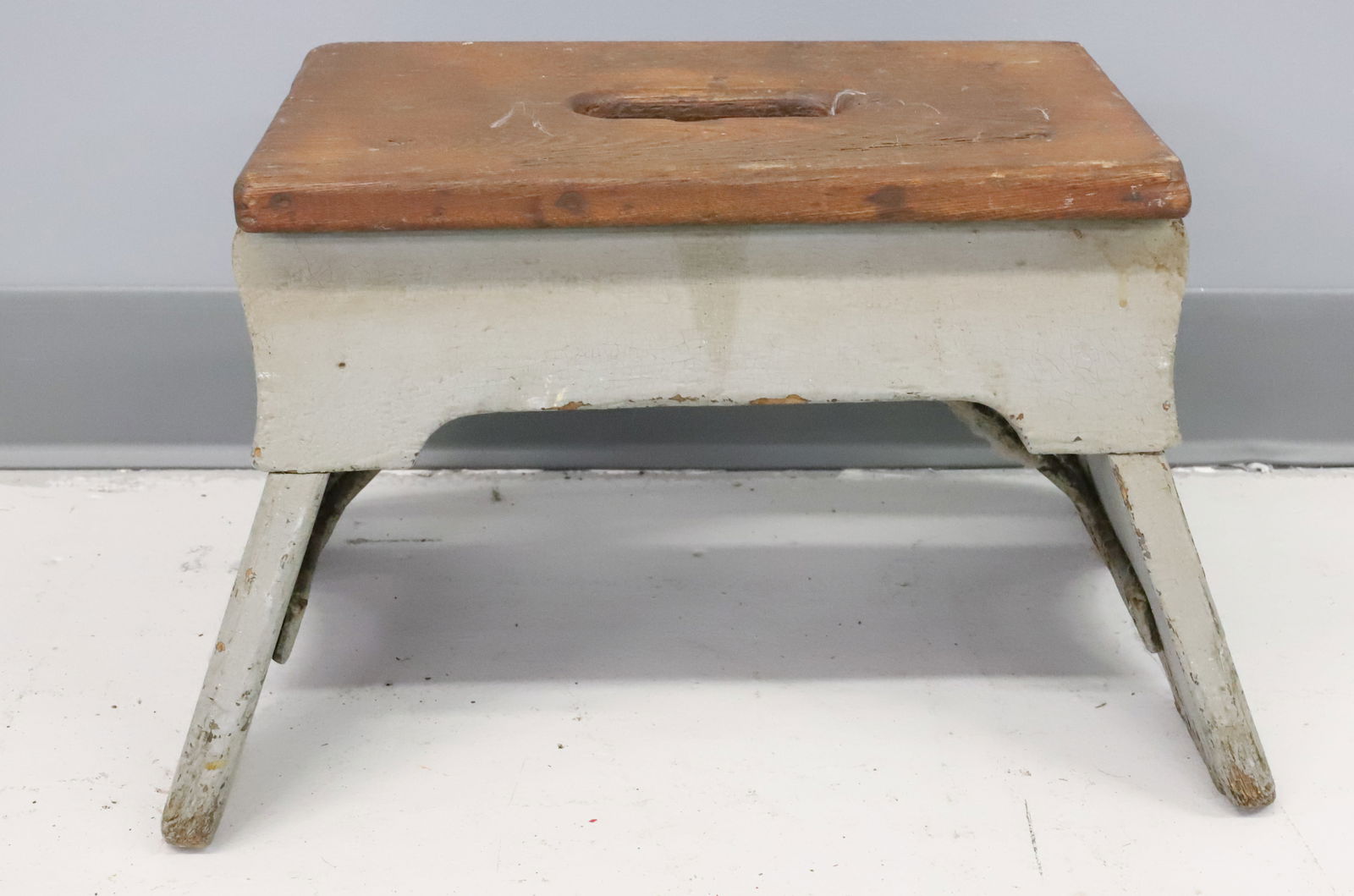 WOODEN RAILROAD STEP STOOL: PAINTED WOOD WITH IRON SUPPORTS UNDERNEATH. 10" X 16" X 11 1/2". PLEASE READ CAREFULLY - Terms for Purchasing and Shipping of Auction Items. Please read carefully before bidding. Hartzell’s Auct