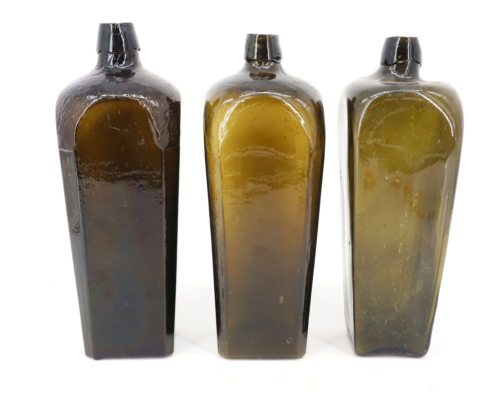 (3) ANTIQUE GIN BOTTLES: DARK OLIVE COLORS, UNMARKED - 10 1/2" H PLEASE READ CAREFULLY - SINCE THIS IS A COIN SALE PLEASE NOTE. ITEMS MUST BE PAID FOR THROUGH LIVE AUCTIONEERS OR WITH CASH OR CHECK IN PERSON - Terms for