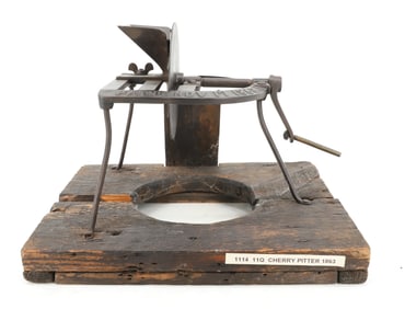 CAST IRON CHERRY PITTER