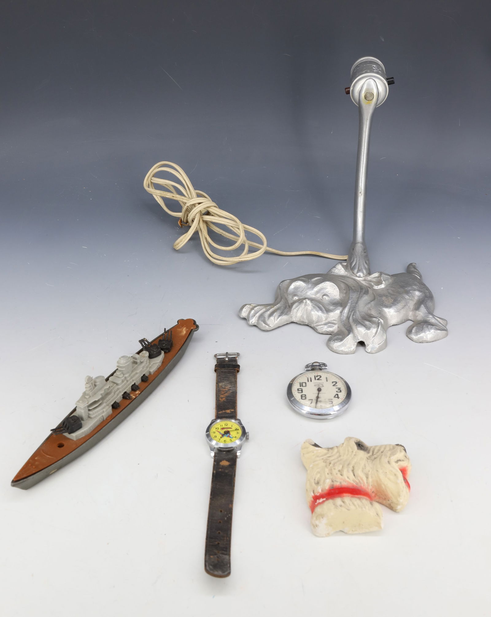 LOT OF WATCHES, TOOTSIETOY, DOG LIGHT: SUPERMAN WRISTWATCH (RUNS, MISSING CRYSTAL), TEMLEX TRAIN POCKET WATCH (FRANCE) RUNS, TOOTSIETOY BATTLESHIP 8" L., CHALKWARE DOG AND ALUMINUM DOG WALL LIGHT. PLEASE READ CAREFULLY - SINCE THIS IS