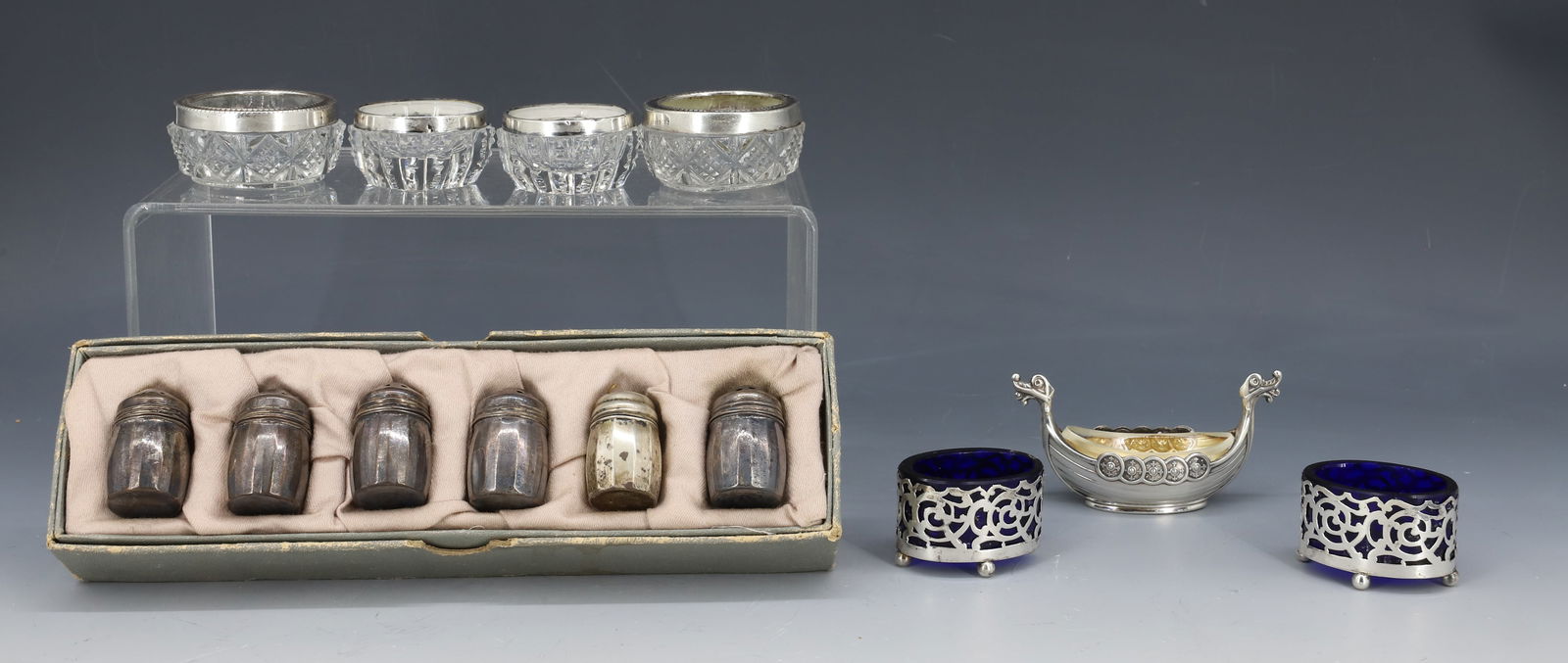 (13) STERLING SILVER SALT DIPS/SHAKERS: FOUR CUT GLASS SALTS WITH ENGLISH HALLMARKS, PAIR OF COBALT BLUE GLASS ENGLISH HALLMARKS, 925 NORWAY VIKING SHIP SALT AND SET OF SIX SHAKERS IN GIFT BOX 1" X 2",3 1/2"L,1 1/2" PLEASE READ CAREFULLY -