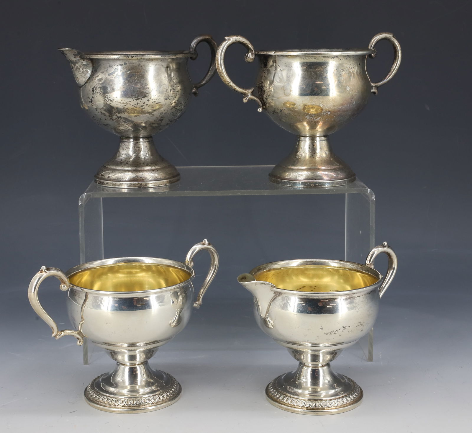 (4) STERLING SILVER WEIGHTED BASE, CREAMERS,SUGARS: PAIR LA PIERRE, PAIR REGENT 3 3/4" X 5 1/4" PLEASE READ CAREFULLY - SINCE THIS IS A COIN SALE PLEASE NOTE. ITEMS MUST BE PAID FOR THROUGH LIVE AUCTIONEERS OR WITH CASH OR CHECK IN PERSON - Terms for P