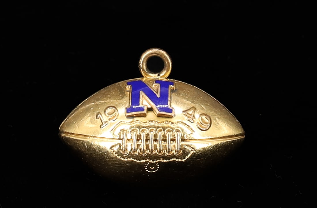 10K FOOTBALL CHARM: WITH ENAMEL "N" 1949 (NAZARETH) PA 1"L TOTAL WEIGHT 3.6 DWT PLEASE READ CAREFULLY - SINCE THIS IS A COIN SALE PLEASE NOTE. ITEMS MUST BE PAID FOR THROUGH LIVE AUCTIONEERS OR WITH CASH OR CHECK