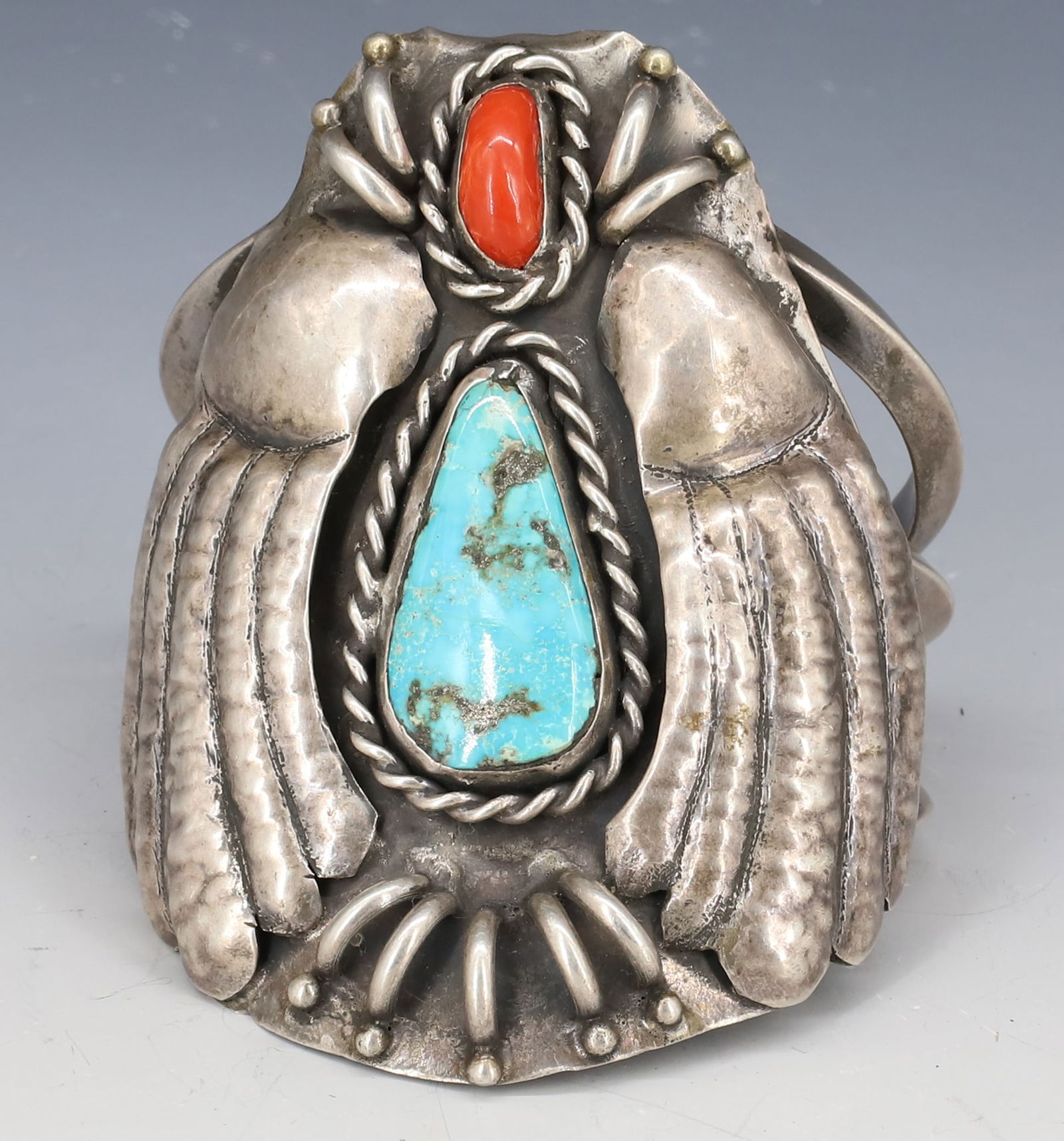 STERLING SILVER NATIVE AMERICAN CUFF "PENELOPE COLLIER" BEETLE CUFF: HAND WROUGHT WINGED BEETLE WITH CHUNK TURQUOISE AND CORAL, MARKED PENELOPE COLLIER STERLING SILVER MORE,NC (MOORE) TURQUOISE 2 1/4" X 2 5/8", INSIDE MEASURE 1 3/4" X 2 1/4" TOTAL WEIGHT 3 7