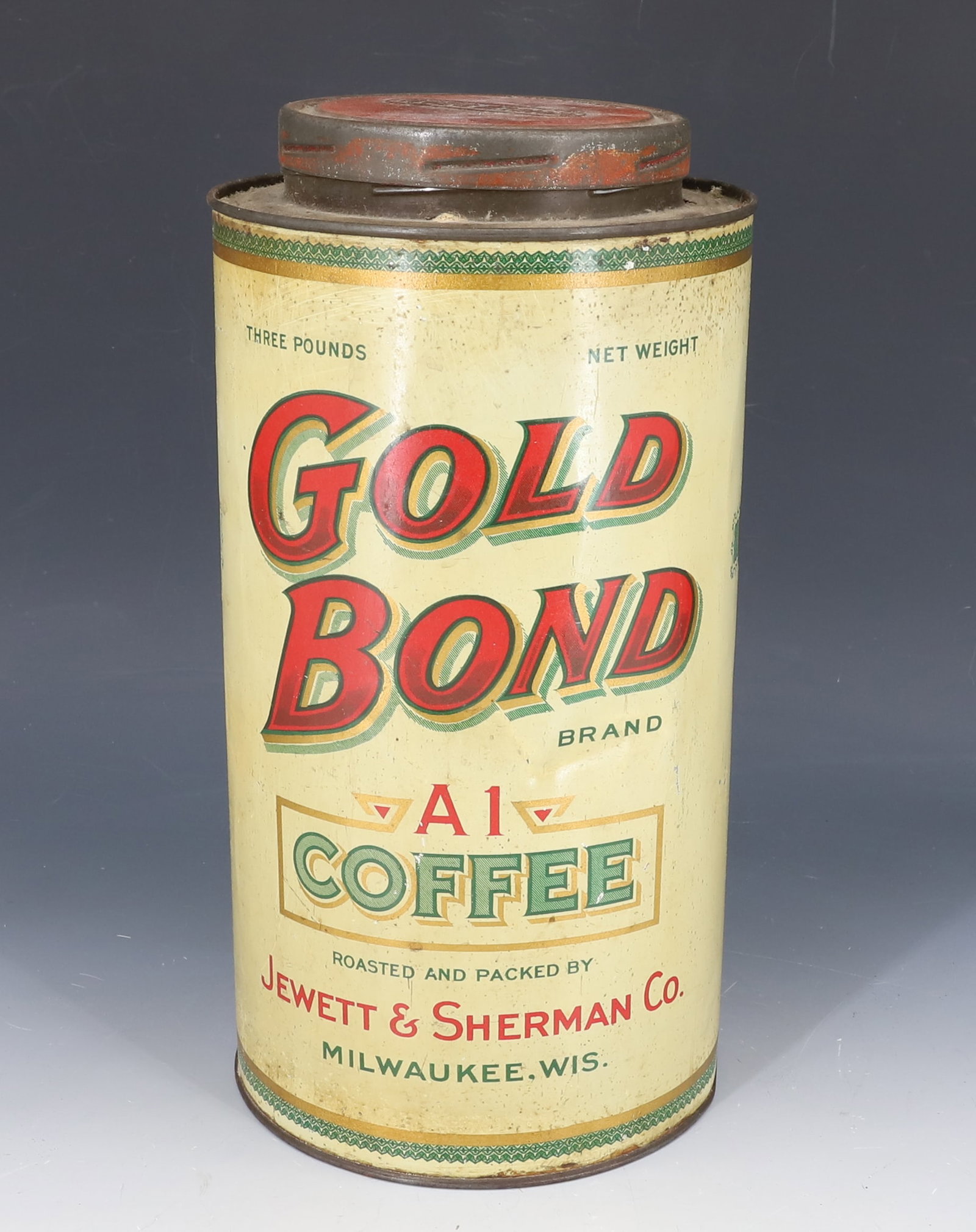 GOLD BOND BRAND COFFEE TIN: TIN LITHO CAN W/ LID. "THREE POUNDS, A1 COFFEE, ROASTED AND PACKED BY JEWETT & SHERMAN CO., MILWAUKEE, WIS." 10 1/2" H. LID MRKD. "WHOLE BEAN". PLEASE READ CAREFULLY - SINCE THIS IS A COIN SALE PLEASE