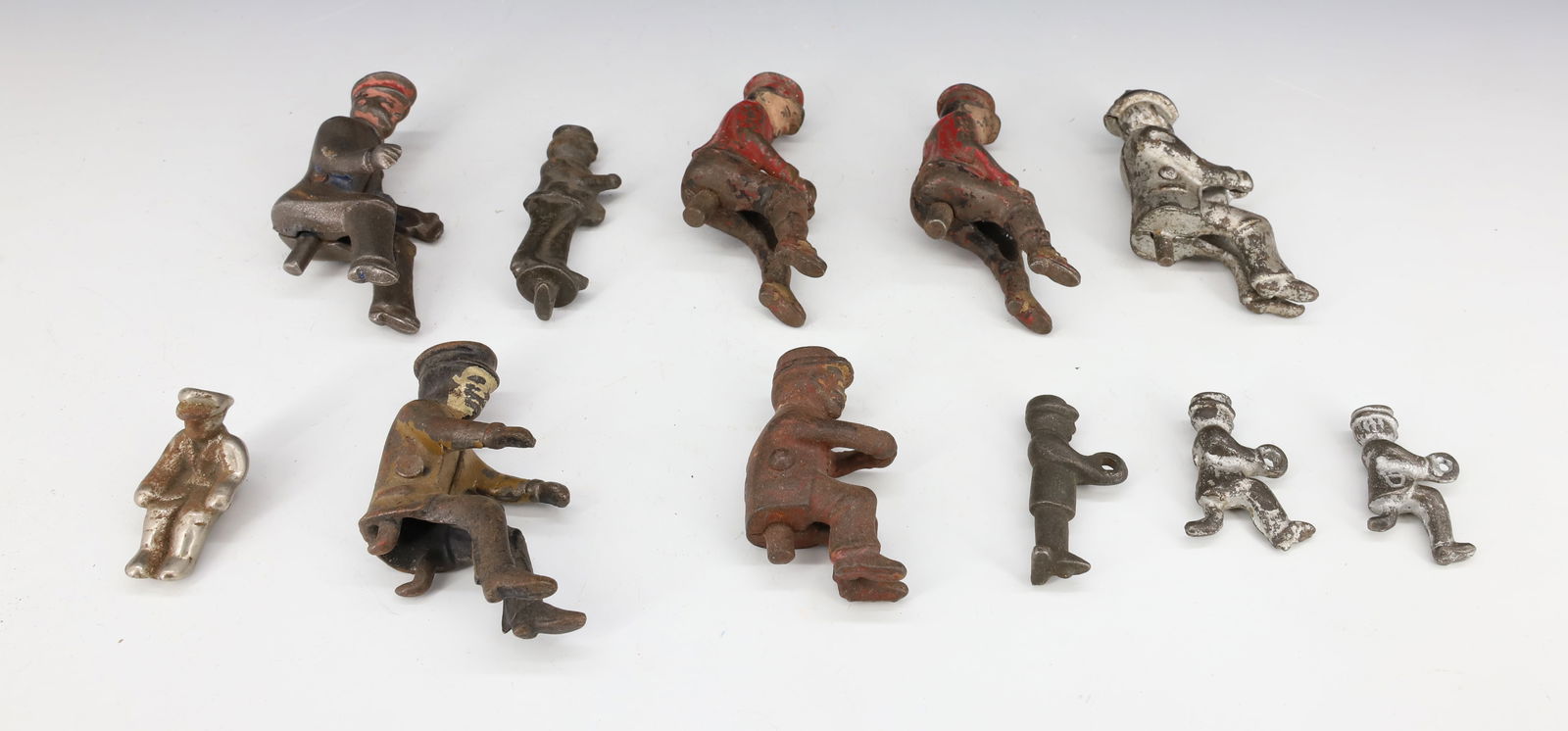 LOT OF ANTIQUE CAST IRON WAGON DRIVERS (1 of 2)