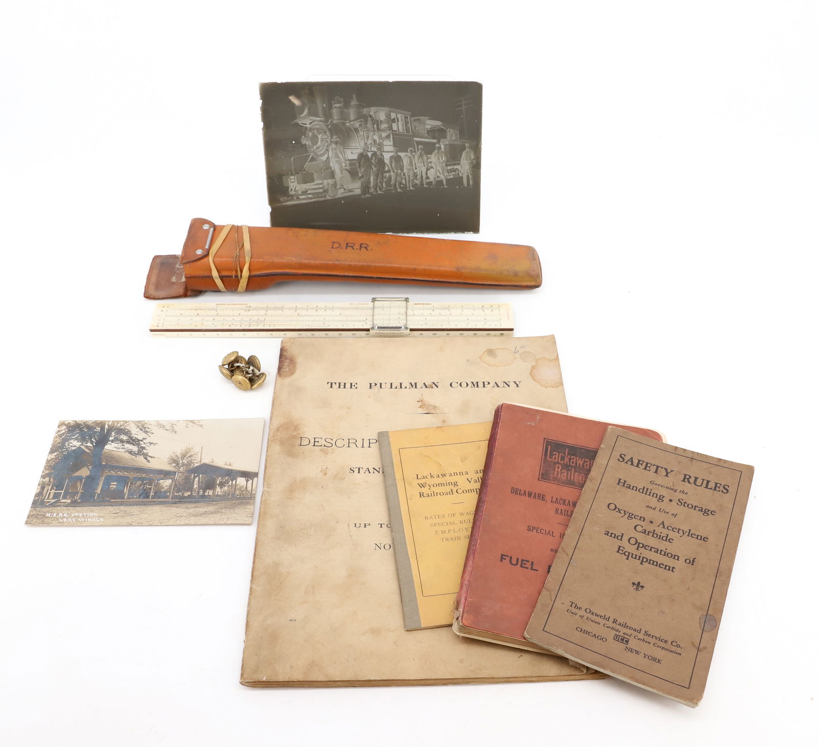 LOT OF RAILROAD RELATED ITEMS: INCLUDING: KEUFFEL & ESSER MEASURE (CASE MRKD. D.R.R.), DELAWARE & HUDSON BUTTONS, GLASS NEGATIVE OF A LOCOMOTIVE "969" 5" X 7". BOOKLETS INCLUDE: LACKAWANNA AND WYOMING VALLEY RAILROAD CO. 1928. 