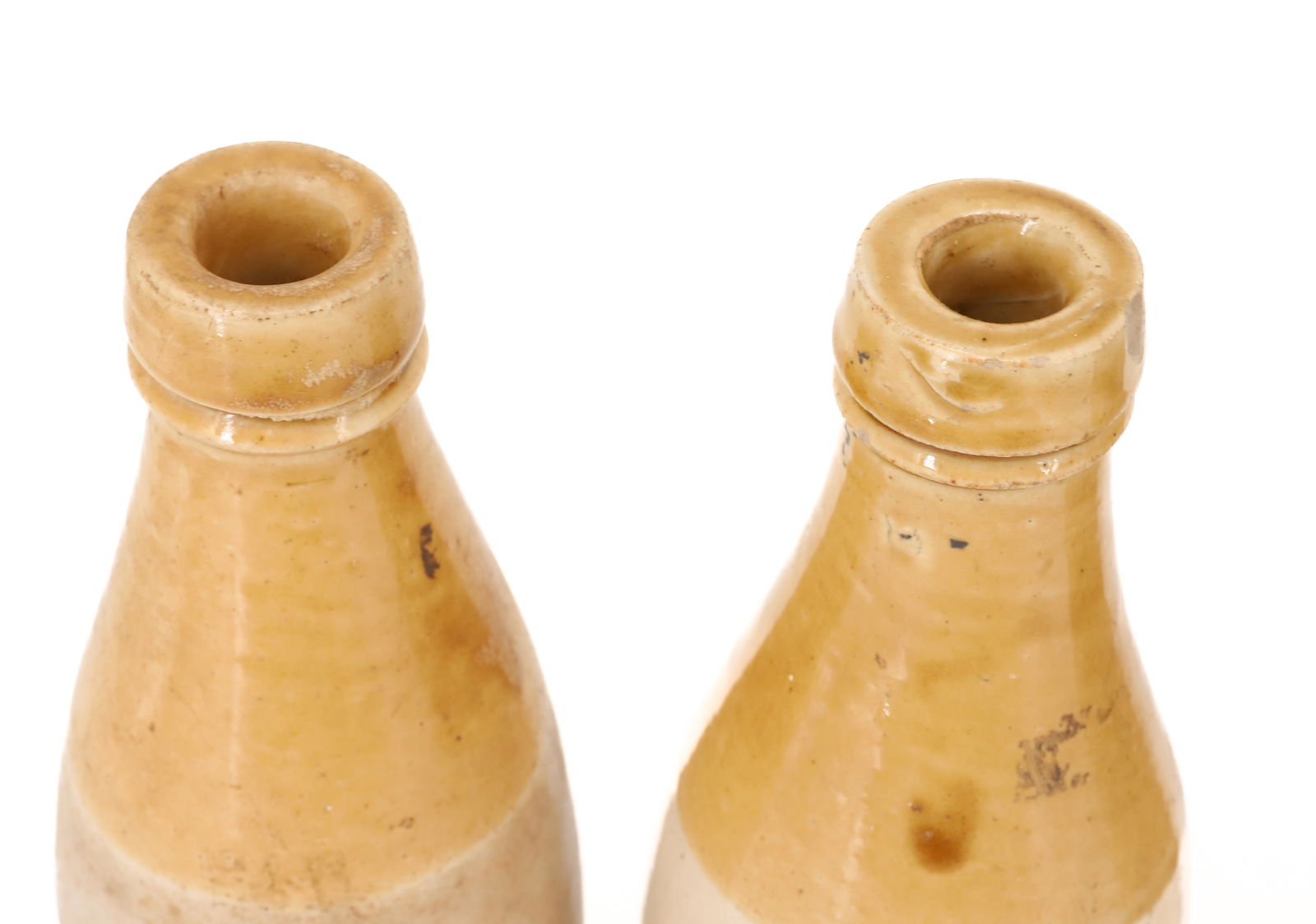 (4) STONEWARE BOTTLES - 7