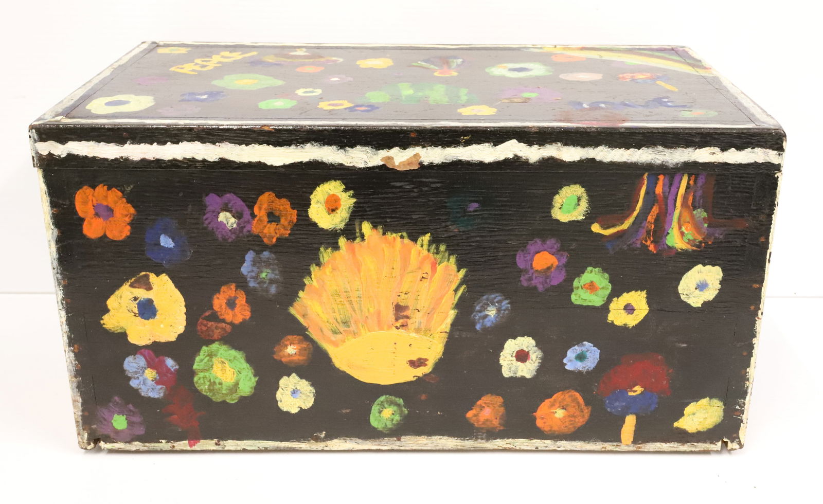 1960/70S HIPPIE PAINTED BOX: BLACK PAINT WITH BRIGHT COLORED FLORAL DECORATION. "PEACE, LOVE". HINGED LID. 10" X 19 1/2" X 11 1/2".