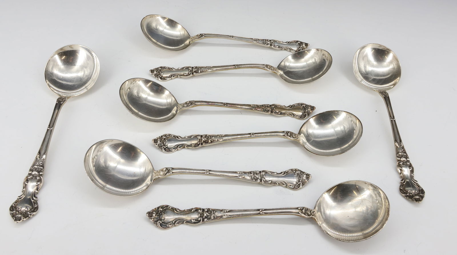 (8) STERLING SILVER CREAM SOUP SPOONS: VICTORIAN PATTERN "M" HALLMARK 6 1/4"L TOTAL WEIGHT 9.19 OZT PLEASE READ CAREFULLY - SINCE THIS IS A JEWELRY AND COIN SALE PLEASE NOTE. ITEMS MUST BE PAID FOR THROUGH LIVE AUCTIONEERS OR WITH