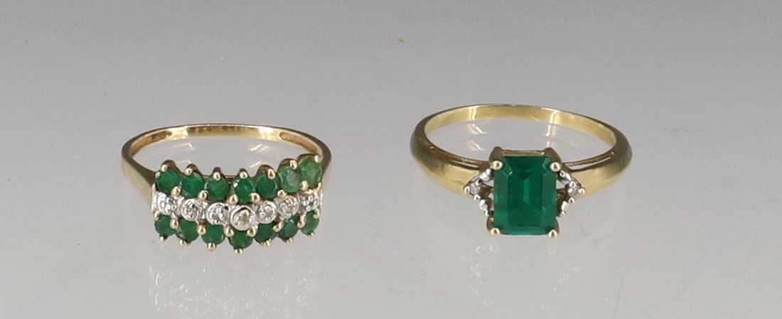 (2) 10K EMERALD RING: EMERALD AND DIAMOND RING SIZE 9, FAUX EMERALD RING SIZE 9 10K TOTAL WEIGHT 2.95 DWT PLEASE READ CAREFULLY - SINCE THIS IS A JEWELRY AND COIN SALE PLEASE NOTE. ITEMS MUST BE PAID FOR THROUGH LIVE