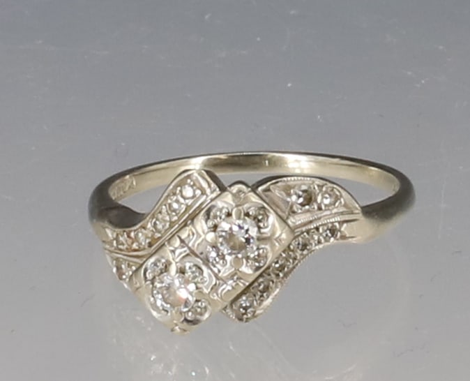 14K WHITE GOLD DIAMOND RING: TWO OFFSET DIAMONDS WITH SIDE DIAMOND SIZE 9 TOTAL WEIGHT 2.5 DWT PLEASE READ CAREFULLY - SINCE THIS IS A JEWELRY AND COIN SALE PLEASE NOTE. ITEMS MUST BE PAID FOR THROUGH LIVE AUCTIONEERS OR WITH CAS