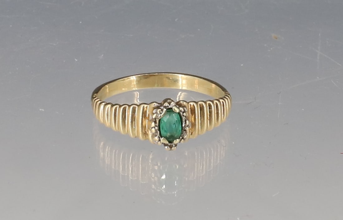 14K YELLOW GOLD EMERALD RING: SIZE 8 1/2 TOTAL WEIGHT 1.9 DWT PLEASE READ CAREFULLY - SINCE THIS IS A JEWELRY AND COIN SALE PLEASE NOTE. ITEMS MUST BE PAID FOR THROUGH LIVE AUCTIONEERS OR WITH CASH OR CHECK IN PERSON - Terms
